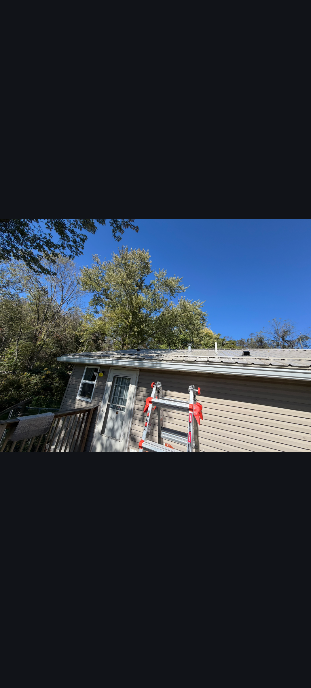 Downspout on Blue Siding